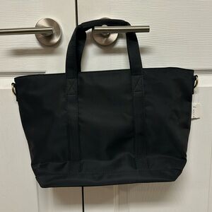 Brand-new Stoney Clover bag. Black with removal shoulder strap.
